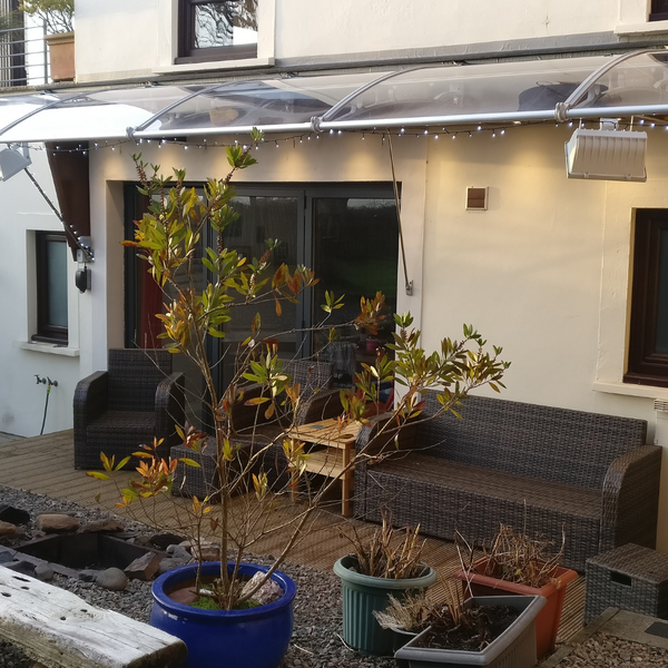 CANOFIX Door Canopy In A Garden.